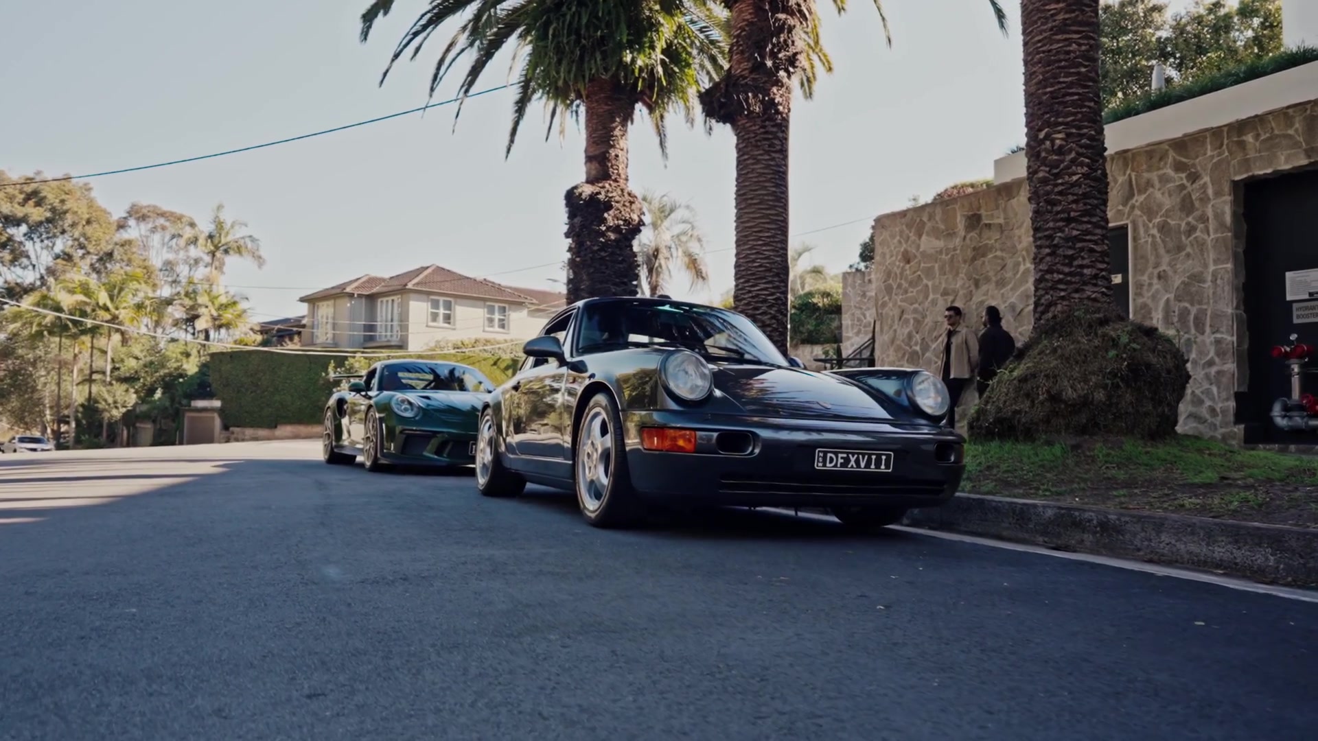 Two Porsche 911s parked on a Sydney street